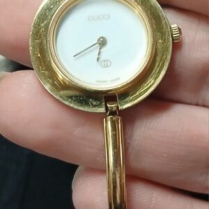 Gucci Gold Timepiece with White Face